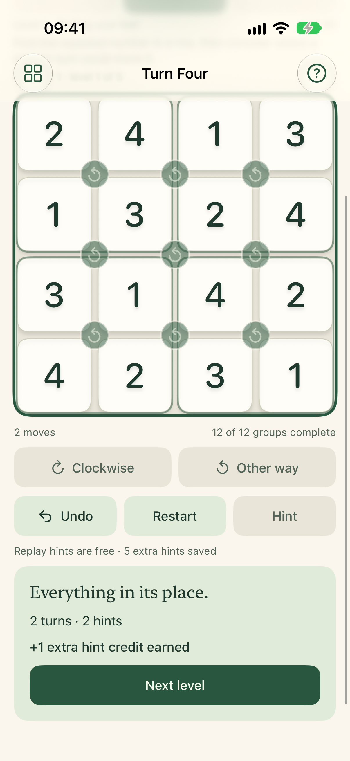 A completed Play level awards one extra hint credit and offers the next level.